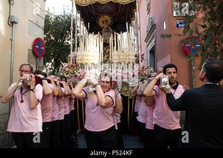 Madrid, Spain. 23rd June, 2018. A man giving orders to the members of the brotherhood at the narrow street of Nuncio in Madrid. © Valentin Sama-Rojo/Alamy Live News. Stock Photo