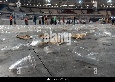 Stratford, UK. 23rd June, 2018, The aftermath of the foo fighters concert day two, Thousands of single-use plastics cups and rubbish littering the stadium floor, London stadium,Stratford,UK..© Jason Richardson / Alamy Live News Stock Photo