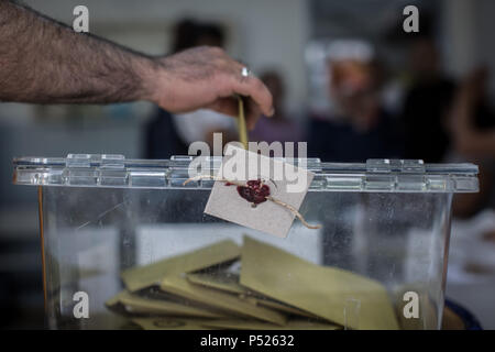 Istanbul, Turkey. 24th June, 2018. A man casts a ballot in a sealed ballot box at a polling station in Istanbul, Turkey, 24 June 2018. The country is holding snap twin elections. Credit: Oliver Weiken/dpa/Alamy Live News Stock Photo