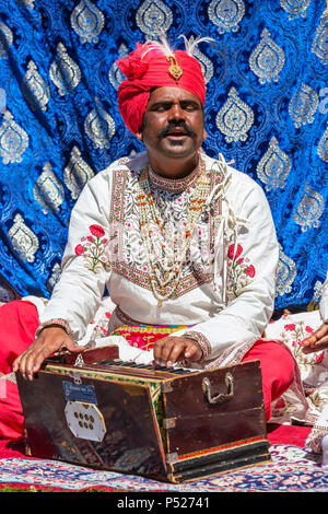 Glasgow, UK. 24th June, 2018. On a sunny summers day, thousands turned out to the annual Glasgow Mela held in Kelvingrove Park to enjoy a day of celebration of all aspects of Asian culture. There were many Asian bands and dance troops including the RAJASTAN HERITAGE BRASS BAND on their second appearance at the Mela and the GABHRU PANJAB DE Asian dance troop from Birmingham on their first appearance Credit: Findlay/Alamy Live News Stock Photo