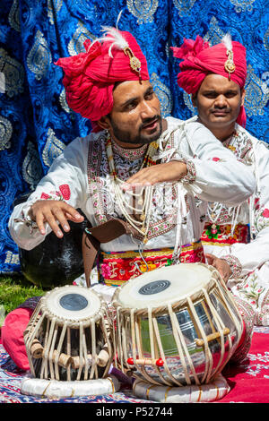 Glasgow, UK. 24th June, 2018. On a sunny summers day, thousands turned out to the annual Glasgow Mela held in Kelvingrove Park to enjoy a day of celebration of all aspects of Asian culture. There were many Asian bands and dance troops including the RAJASTAN HERITAGE BRASS BAND on their second appearance at the Mela and the GABHRU PANJAB DE Asian dance troop from Birmingham on their first appearance Credit: Findlay/Alamy Live News Stock Photo