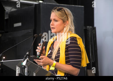 London 23rd June 2018 - Dr Lauren Gavaghan speaking on the affect of Brexit on the NHS. 100,000+ people attend a march to demand a final vote on the Brexit deal. The Peoples Vote March is demanding a referendum on the deal negotiated by the Government with an option to remain in the European Union. The date (23rd June 2018) was significant because that was two years from the day of the original referendum (23rd June 2016). The day saw the launch of a petiton for a Peoples Vote. For further information see https://www.peoples-vote.uk. Credit: Bruce Tanner/Alamy Live News Credit: Bruce Tanner/Al Stock Photo