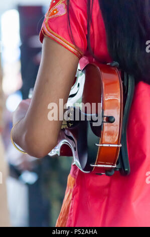 Glasgow, Scotland, UK. 24th June, 2018. Glasgow Mela, an annual multicultural music festival held in Kelvingrove Park. This year's performers included Miss Pooja, Akbar Ali, Black Star Steel Band, G Town Desi, Raj Brass Band, Thai Dance Academy, D & F Bros Grand Indian Circus and traditional bangra dancers Gabhru Panjab De. Credit: Skully/Alamy Live News Stock Photo