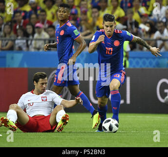 Kazan, Russia. 24th June, 2018. James Rodriguez (R) of Colombia breaks through with the ball during the 2018 FIFA World Cup Group H match between Poland and Colombia in Kazan, Russia, June 24, 2018. Credit: He Canling/Xinhua/Alamy Live News Stock Photo