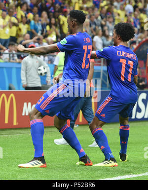 Kazan, Russia. 24th June, 2018. Colombia's Yerry Mina (L) and Juan Cuadrado celebrate scoring during the 2018 FIFA World Cup Group H match between Poland and Colombia in Kazan, Russia, June 24, 2018. Credit: He Canling/Xinhua/Alamy Live News Stock Photo