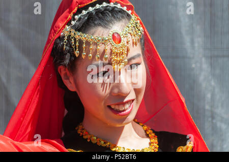 Glasgow, Scotland, UK. 24th June, 2018. Glasgow Mela, an annual multicultural music festival held in Kelvingrove Park. This year's performers included Miss Pooja, Akbar Ali, Black Star Steel Band, G Town Desi, Raj Brass Band, Thai Dance Academy, D & F Bros Grand Indian Circus and traditional bangra dancers Gabhru Panjab De. Credit: Skully/Alamy Live News Stock Photo