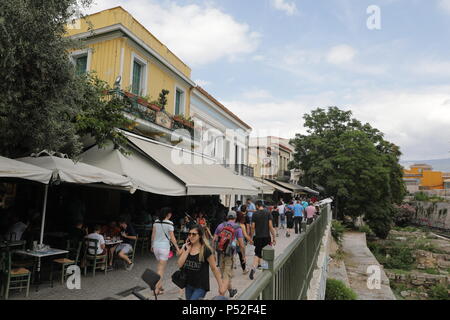 Athens, Greece. 24th June, 2018. Locals and tourists walk past coffee shops in downtown Athens, Greece, on June 24, 2018. Greece's coffee industry is rapidly growing, with the coffee lovers widening, according to latest figures from the International Coffee Organization (ICO). Credit: Lefteris Partsalis/Xinhua/Alamy Live News Stock Photo