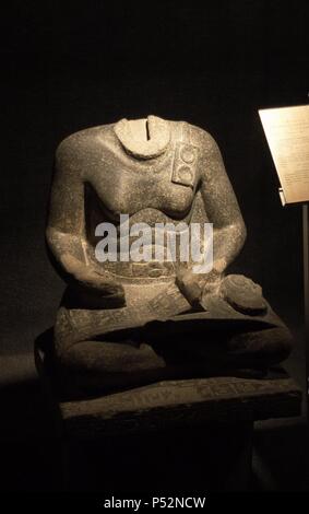 Statue of Mentuhotep. Middle Kingdom. 12th Dynasty. Vizier under Sesostris I. Headless statue, represented as a scribe, from Temple of Amun at Karnak. Egyptian Art Museum. Luxor. Egypt. Stock Photo