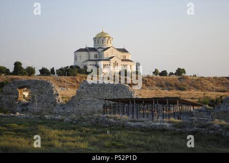 Ukraine. Ruins of greek colony Chersonesus Taurica. 6th century BC. At background, Neo-Byzantine Russian Orthodox Church reconstructed at 21th century by E. Osadchiy. Sevastopol. Stock Photo