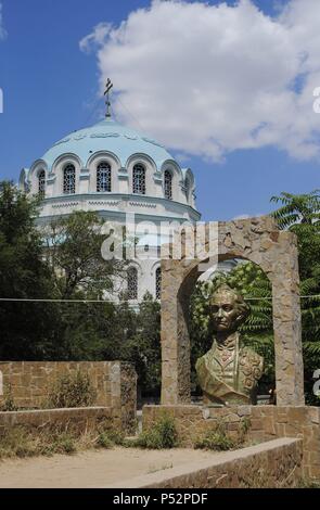 Alexander Suvorov (1729-1800). Last Generalissimo of the Russian Empire. Bust by A. Maksimenko. At background, the Dome of the St. Nicholas the Miracle Worker Cathedral. Yevpatoria. Ukraine. Stock Photo