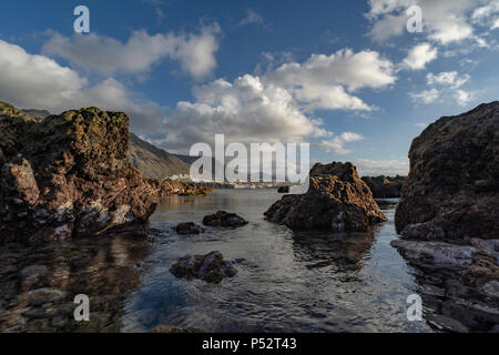 Punta del Hidalgo, Tenerife. Sun setting over Natural Pools in Punta del Hidalgo Stock Photo