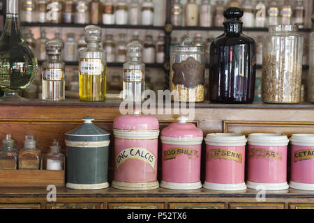 Old fashioned Pharmaceutical display in a Victorian Apothecary Stock Photo