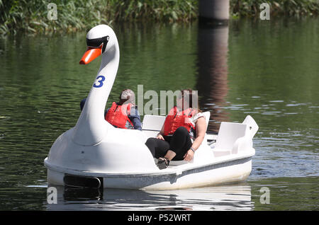 People ride on a boat in the Queen Elizabeth Olympic Park in east London, during the predicted warm weather. PRESS ASSOCIATION. Picture date: Sunday June 24, 2018. Photo credit should read: Isabel Infantes/PA Wire Stock Photo
