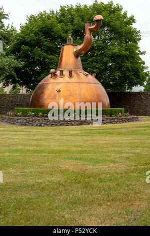 The emblematic Copper Still Pot at the entrance of the Old Jameson Whiskey Distillery in Midleton, Ireland as part of the Jameson Experience. Stock Photo