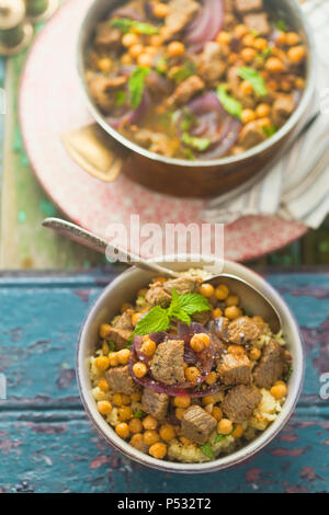 Moroccan spiced lamb with chickpeas and red onion Stock Photo