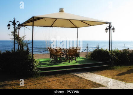 outdoor bamboo garden furniture set by beach Stock Photo