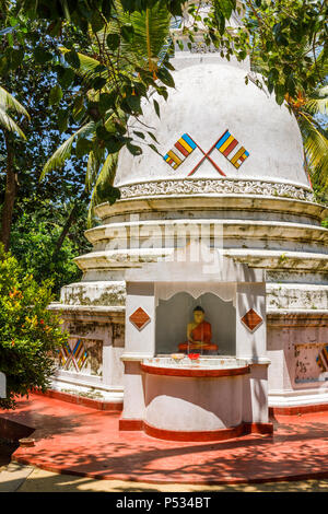 Buddhist stupa at Sri Wickramasinghe ancient temple, Maduwa Island visited on a boat trip on the Madu River, Madu Ganga wetlands, south-west Sri Lanka Stock Photo