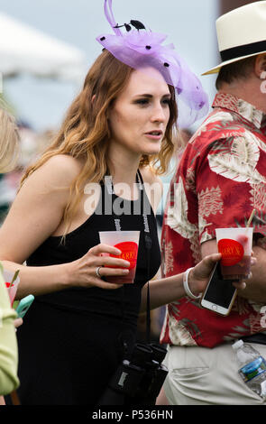 The Plains, Virginia/USA-5-19-17: Woman carries  drinks during The Virginia Gold Cup. Stock Photo
