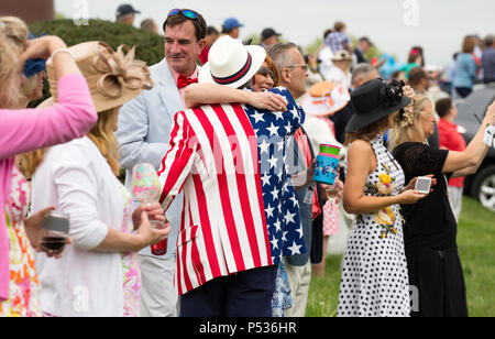 The Plains, Virginia/USA-5-19-17: Couple hugs in the crowd at The Virginia Gold Cup. Stock Photo
