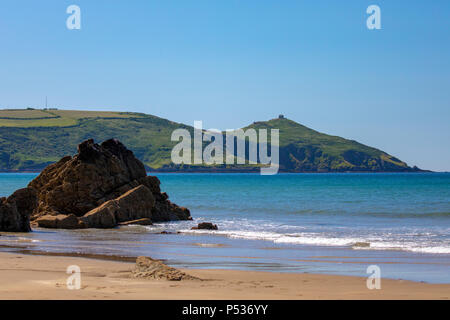 Rame Head Chapel on the Rame Peninsula at Whitsand Bay, Cornwall on a hot summers days, clear blue sky and turquoise sea Stock Photo