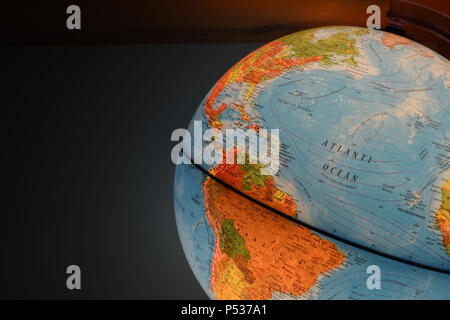 Globe on shelf Stock Photo