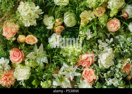 Variety of artificial flowers and plants as a background Stock Photo