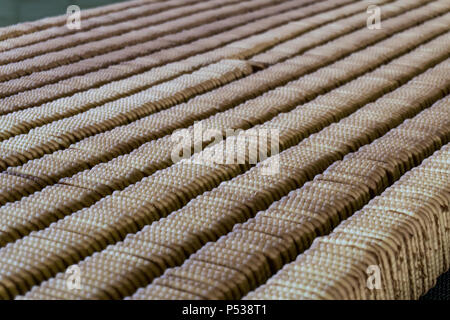 Automated biscuit cookies production processing plant conveyor. Stock Photo