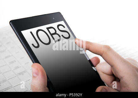 human hand pushing on a touch screen Stock Photo