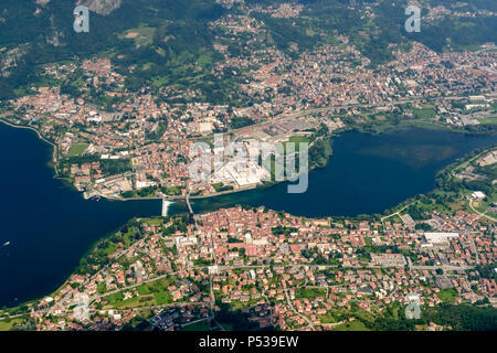 aerial shot, from a small plane, of villages on Adda river, shot on a bright late springtime day at Calolziocorte, Lombardy, Italy Stock Photo