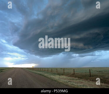 A wall cloud forms under a rotating supercell thunderstorm, over farmland in Nebraska, USA Stock Photo