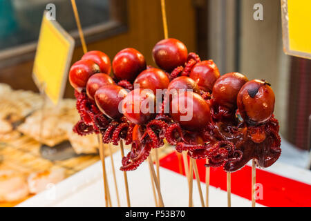 Baby octopus stuffed with a quail egg at market in Kyoto. Japan Stock Photo