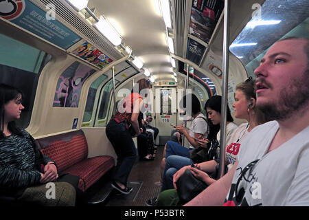 Passengers on the Glasgow subway, SPT underground railway, city centre train / railway, Strathclyde, Scotland, UK Stock Photo