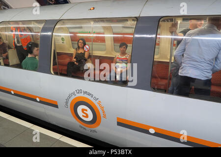 Passengers on the Glasgow subway, SPT underground railway, city centre train / railway, Strathclyde, Scotland, UK Stock Photo