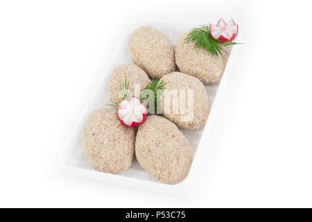 Freshly frozen semi-finished products. Cutlets from tender meat of chicken in a cover made of biscuits. Isolate on white background. Stock Photo