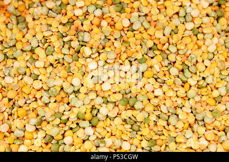 Dried yellow green peas laid out evenly. Photo with a shallow depth of field. Stock Photo