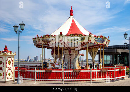 Vintage carousel with horses. A horse on a children's vintage carousel. Stock Photo