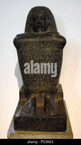 Granodiorite block-statue of Amenhotep. Rows of text at front. 18th Dynasty. New Kingdom period. British Museum. London. England. United Kingdom. Stock Photo