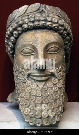 Head from a statue of a bearded man with laurel wreath. Limestone. Sculpted in Cyprus early 5th century BC. From the Sanctuary of Apollo at Pyla. British Museum. London. England. United Kingdom. Stock Photo