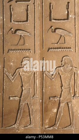 Egypt. Necropolis of Saqqara. Mastaba of Kagemni (2350 BC). Chief Justice and vizier of the Pharaoh Teti. Relief. Hieroglyph and male figure, probably the deceased. 6th Dynasty. Old Kingdom. Stock Photo