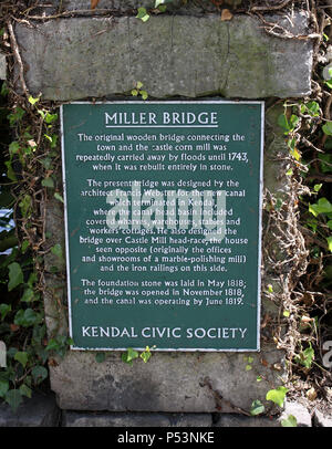 Kendal Civic Society plaque for Miller Bridge with details of the bridges history on wall by the bridge over River Kent in Kendal, Cumbria, England. Stock Photo