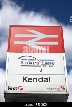 Railway station sign outside Kendal station, Cumbria, England that still carries the old British Rail logo as well as the Lakes Line branding. Stock Photo