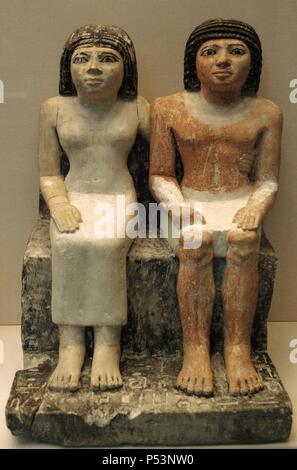 Kaitep and his wife Hetepheres. Seated sculptures of polychromed limestone. 2300 BC. 5th - 6th Dynasties. Early Dynastic Period or Old Kingdom. Possibly from Giza. British Museum. London. United Kingdom. Stock Photo