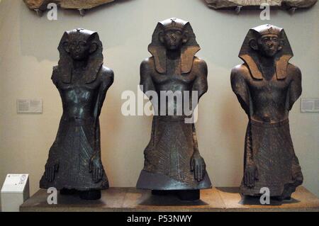 Three black granite statues of Sesostris III. 1850 BC. 12th Dynasty. Middle Kingdom. From the Temple of Mentuhotep, Lower South Court. Deir el-Bahri, Thebes. British Museum. London. United Kingdom. Stock Photo