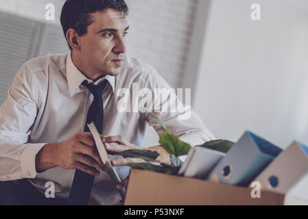 Depressed young man looking aside Stock Photo