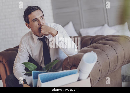 Cheerless thoughtful man thinking about his life Stock Photo