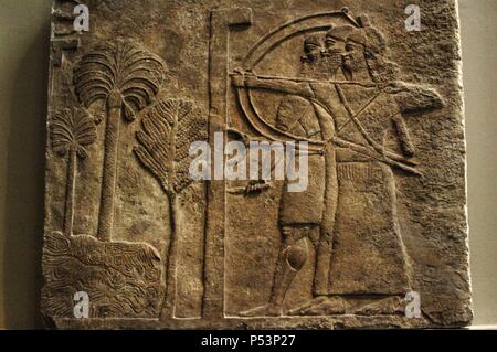 Relief depicting a siege of a city. 728 BC. Central Palace. Nimrud. British Museum. London. United Kingdom. Stock Photo