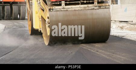 Road roller on asphalt pavement works. Barcelona. Spain. Stock Photo