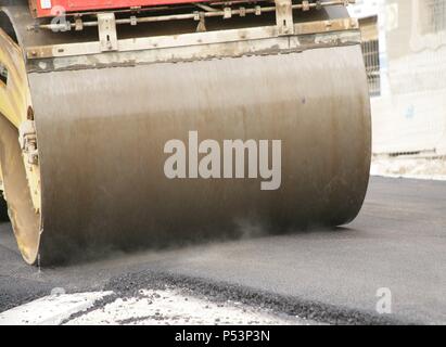 Road roller on asphalt pavement works. Barcelona. Spain. Stock Photo