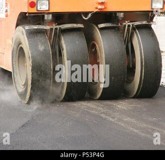 Road roller on asphalt pavement works. Barcelona. Spain. Stock Photo