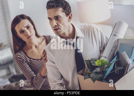 Depressed cheerless man thinking about his life Stock Photo